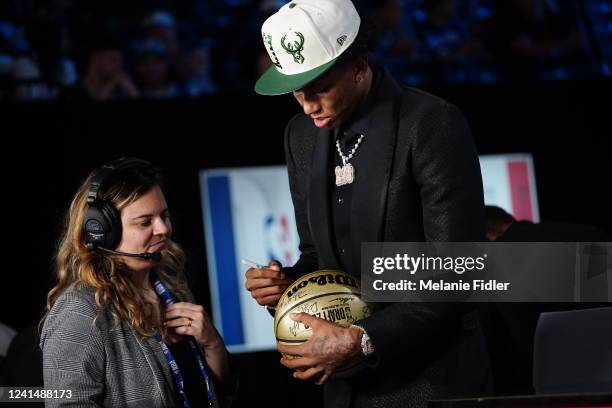 MarJon Beauchamp signs autograph after being selected by the Milwaukee Bucks during the 2022 NBA Draft on June 23, 2022 at Barclays Center in...