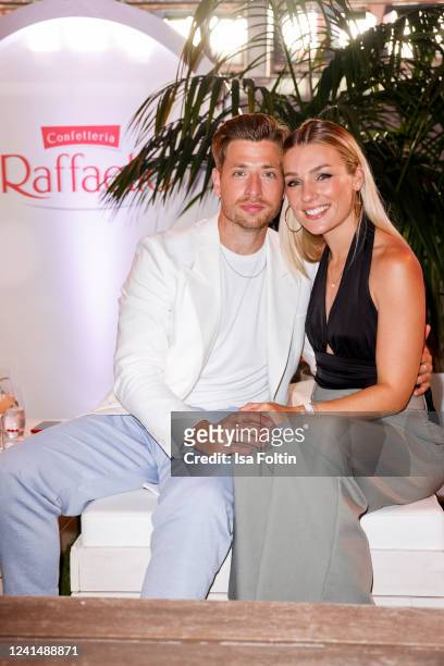 German actor Dominik Flade and his girlfriend Anna Karolin Berger attends the "Raffaello Summer Day" on June 23, 2022 in Berlin, Germany.