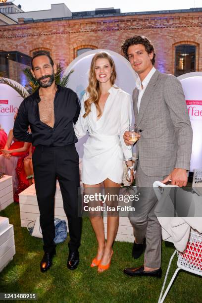 Dancer Massimo Sinato, model Kim Riekenberg and her boyfriend model Alessandro Hasni attend the "Raffaello Summer Day" on June 23, 2022 in Berlin,...