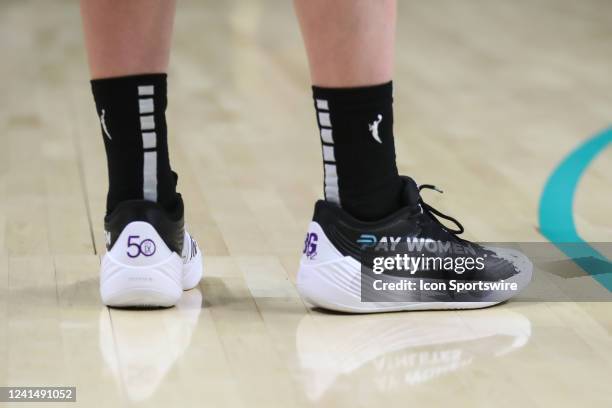 Los Angeles Sparks forward Katie Lou Samuelson sneakers "Pay Women Athletes" during the Chicago Sky game versus the Los Angeles Sparks, on June 23 at...