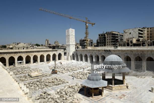 Blocks of ashlar are arranged in the courtyard of the Grand Umayyad mosque in the northern Syrian city of Aleppo on June 23 during its renovation as...