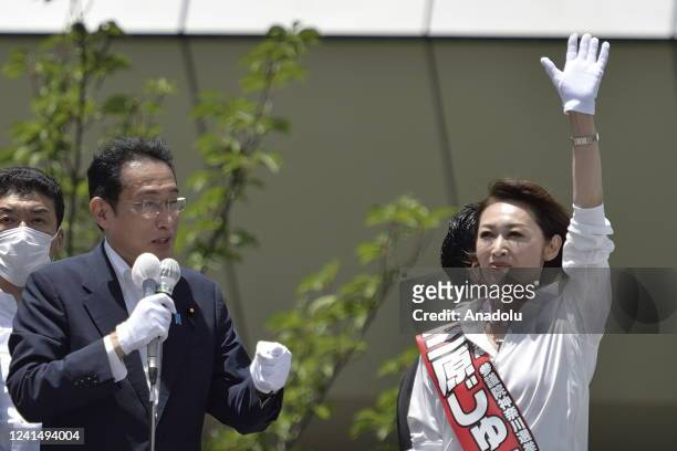 Fumio Kishida , Prime Minister of Japan and President of the Liberal Democratic Party , delivers a speech as he attends a street meeting with a...