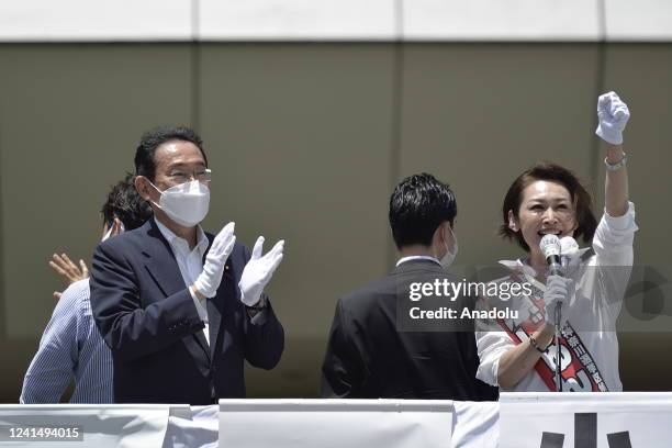 Fumio Kishida , Prime Minister of Japan and President of the Liberal Democratic Party , attends a street meeting with a candidate of the ruling...