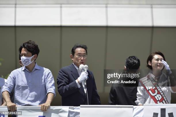 Fumio Kishida , Prime Minister of Japan and President of the Liberal Democratic Party , delivers a speech as he attends a street meeting with a...