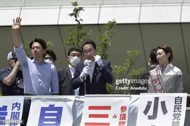 Fumio Kishida , Prime Minister of Japan and President of the Liberal Democratic Party , delivers a speech as he attends a street meeting with a...