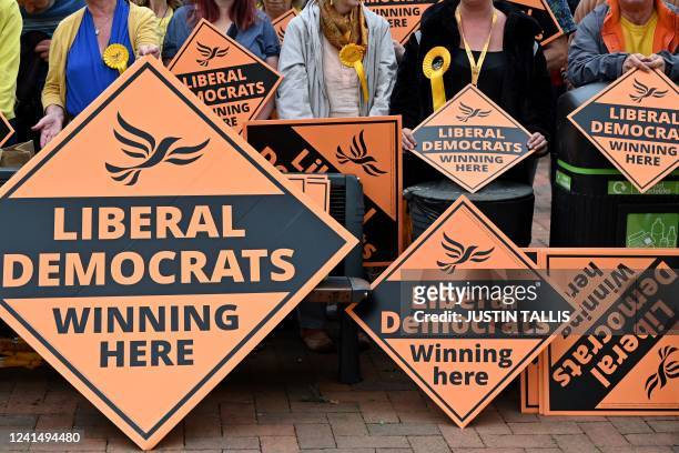 Supporters of Britain's centrist Liberal Democrats party gather in Tiverton on June 24, 2022 to celebrate the party's historical Tiverton and Honiton...