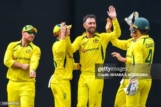 Australia's Glenn Maxwell celebrates with teammates after taking the wicket of Sri Lanka's Kusal Mendis during the final one-day international...