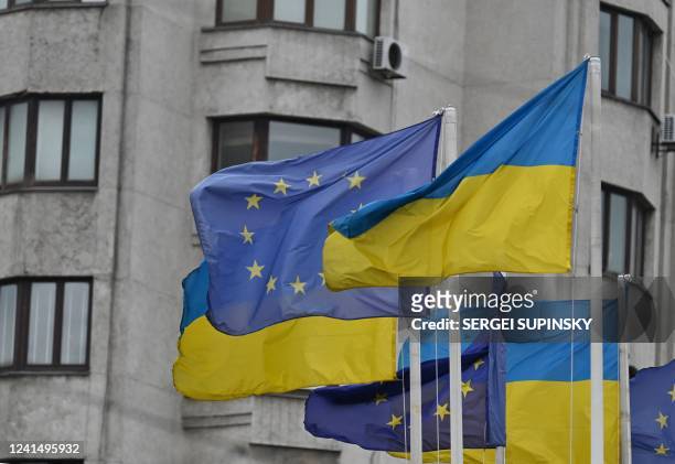 Flags of Ukraine and European Union wave at European Square in Kyiv on June 24 amid Russian invasion of Ukraine. - In a show of support, European...