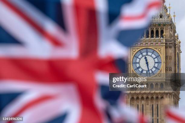 Elizabeth Tower, often known as Big Ben, is pictured behind a British flag on June 24, 2022 in London, England. The Conservatives lost both the...