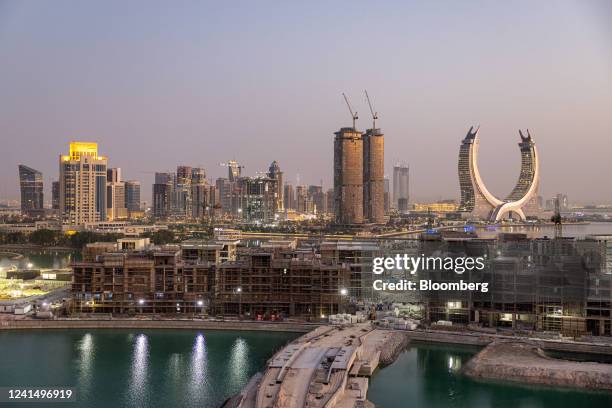 The Katara Towers, right, beyond major construction works in the Lusail development in Doha, Qatar, on Thursday, June 23, 2022. About 1.5 million...