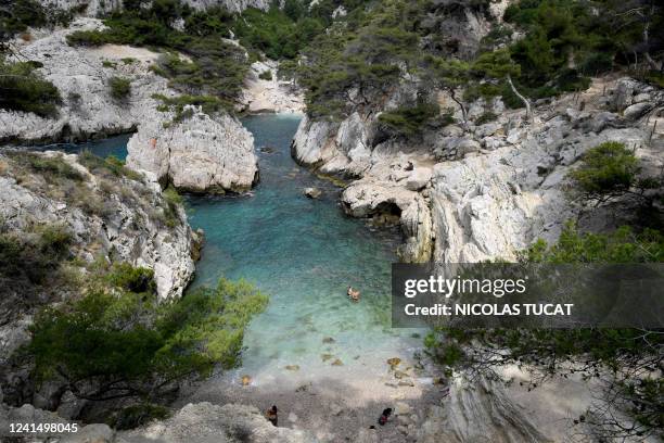 People enjoy the calanque de Sugiton in the Parc national des calanques in Marseille, southern France, on June 24, 2022. Reservations for access to...