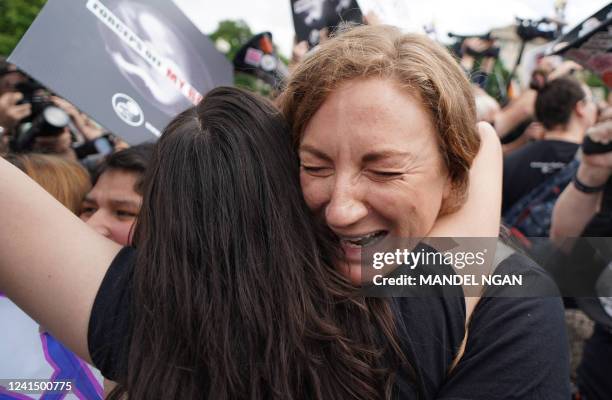 Pro-life activists hug outside the US Supreme Court in Washington, DC, on June 24, 2022. The US Supreme Court on Friday ended the right to abortion...