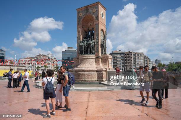 Tourists visit the Republic Monument on Taksim Square in Istanbul, Turkey, on Friday, June 24, 2022. Tourism arrivals in May surged 308%...