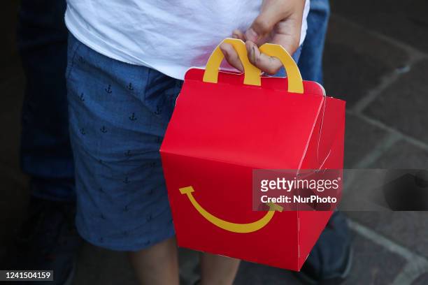 Child holds McDonald's Happy Meal box in Krakow, Poland on June 23, 2022.