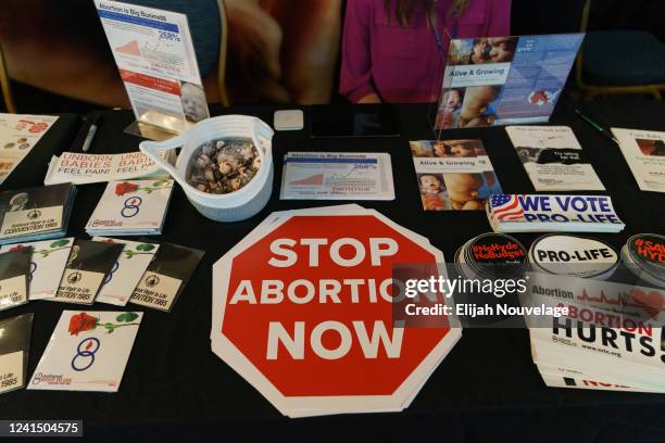 Stickers and literature are seen at a booth at the National Right To Life Convention at the Atlanta Airport Marriott Hotel on June 24, 2022 in...