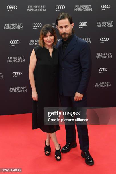 June 2022, Bavaria, Munich: Actor Clemens Schick joins Jeanne Tremsal on the Red Carpet at the Isarphilharmonie Film Festival. The festival shows...