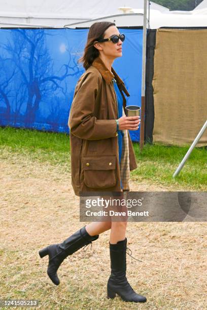 Alexa Chung is seen on Day One of the festival wearing her vintage Barbour jacket on June 24, 2022 in Glastonbury, England.