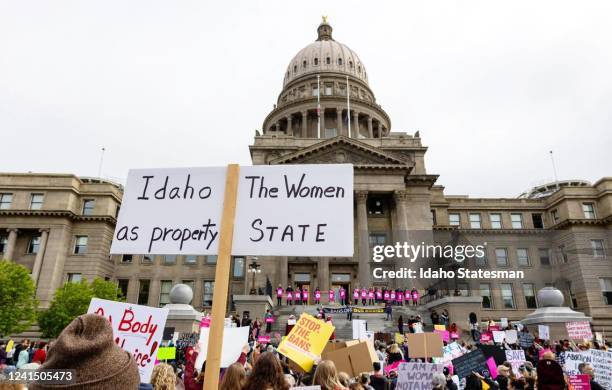 An attendee at an abortion rights rally holds a sign outside the Idaho Capitol on May 14. The U.S. Supreme CourtÂs reversal of Roe v. Wade and...