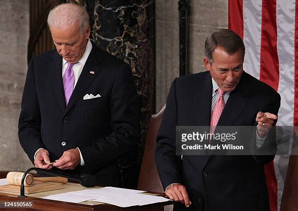 Speaker of the House John Boehner points to a colleague as he waits with U.S. Vice President Joe Biden prior to the start of a Joint Session of...
