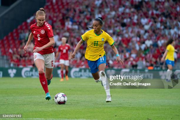 Adriana Silva of Brazil and Karen Holmgaard of Denmark battle for the ball during the Women's International Friendly match between Denmark and Brazil...