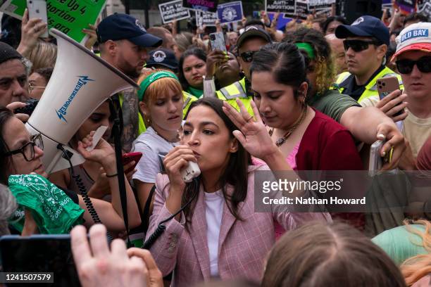 Rep. Alexandria Ocasio-Cortez speaks to abortion-rights activists in front of the U.S. Supreme Court after the Court announced a ruling in the Dobbs...