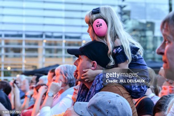 Illustration picture shows a young festival goer wearing ear protection on the first day of the Genk on Stage free music festival in Genk, Friday 24...