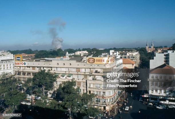 View over the city of Saigon from the Caravel Hotel as the Presidential Palace is bombed by defecting South Vietnam Air Force pilot, Nguyễn Thành...