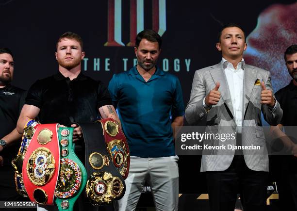 Boxer Canelo Alvarez and Gennady Golovkin pose, with boxing promotor Eddie Hearn during a news conference on June 24, 2022 in Hollywood, California....