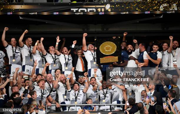 Montpellier's French-Syrian President Mohed Altrad , Montpellier's French hooker Guilhem Guirado and his teammates celebrate with the Bouclier de...