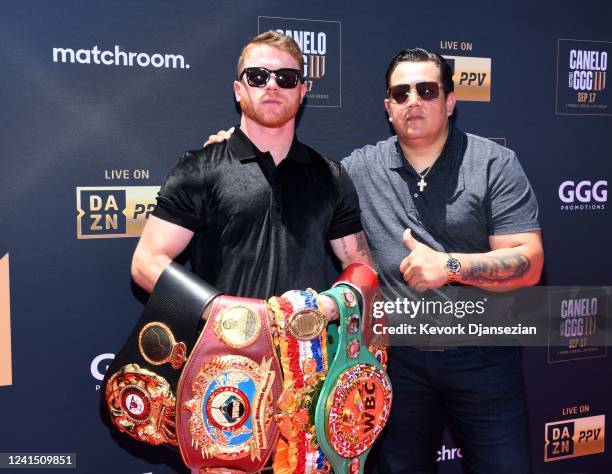 Boxer Canelo Alvarez and trainer Eddy Reynoso pose on the red carpet prior to a news conference with boxer Gennadiy Golovkin on June 24, 2022 in...