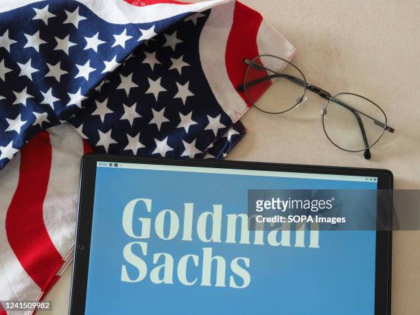 In this photo illustration, Goldman Sachs Group logo seen displayed on a tablet.