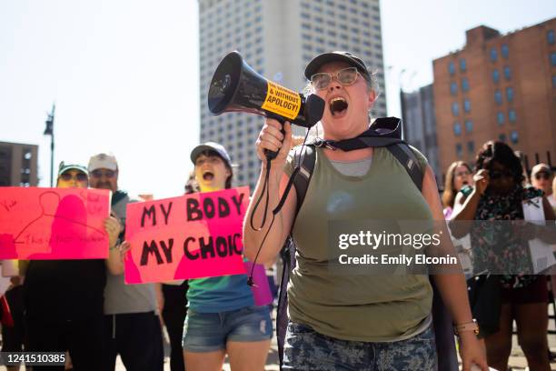 Abortion rights demonstrators chant as they gather to protest the Supreme Court's decision in the Dobbs v Jackson Women's Health case on June 24,...