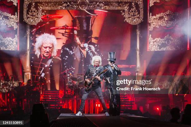 Brian May of the British band Queen and singer Adam Lambert perform live on stage during a concert at the Mercedes-Benz Arena on June 24, 2022 in...