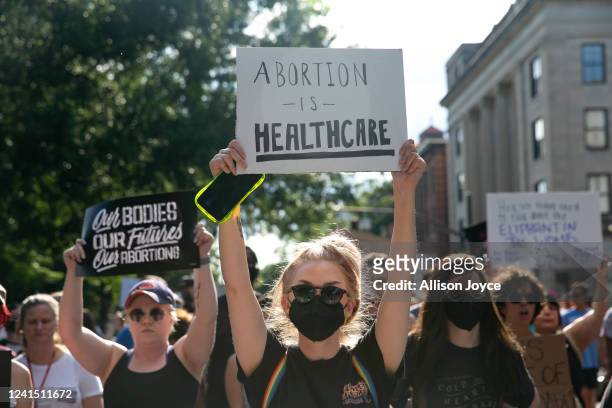 People gather to protest against the the Supreme Court's decision in the Dobbs v Jackson Women's Health case on June 24, 2022 in Raleigh, North...