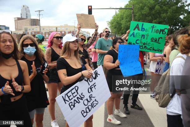 Abortion rights demonstrators gather near the Hubert H. Humphrey School of Public Affairs at the University of Minnesota in Minneapolis, Minnesota,...