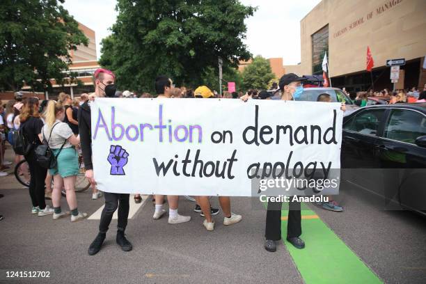 Abortion rights demonstrators gather near the Hubert H. Humphrey School of Public Affairs at the University of Minnesota in Minneapolis, Minnesota,...