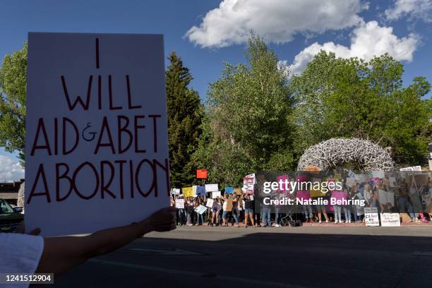 Abortion rights protesters chant slogans during a gathering to protest the Supreme Court's decision in the Dobbs v Jackson Women's Health case on...