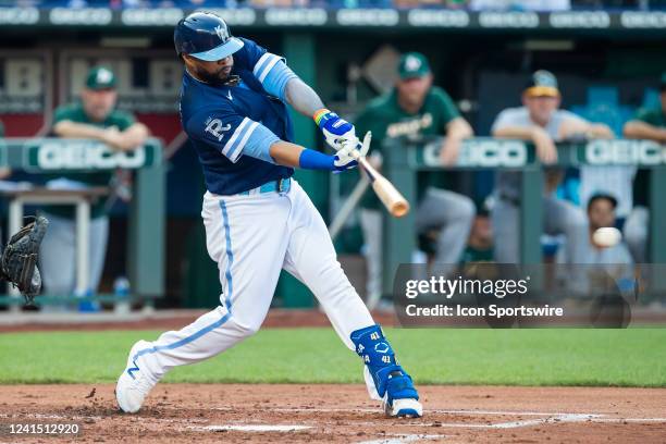 Royals first baseman Carlos Santana puts the ball into play during the game between the Kansas City Royals and the Oakland Athletics on Friday June...