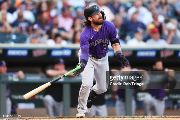 Brendan Rodgers of the Colorado Rockies doubles to the right in the second inning during the game between the Colorado Rockies and the Minnesota...