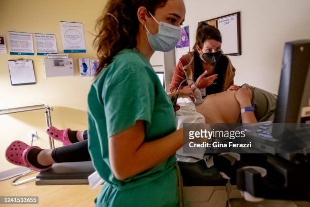 Family physician and her resident perform an ultrasound on a 25-year-old woman the day before the Supreme Court overturned Roe v. Wade at the Center...
