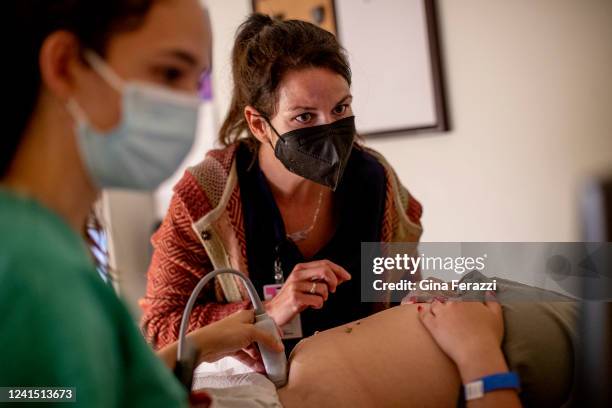 Family physician and her resident perform an ultrasound on a 25-year-old woman the day before the Supreme Court overturned Roe v. Wade at the Center...