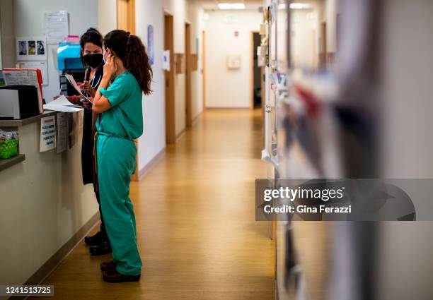 Family physician and her resident confer before performing a surgical abortion on a 39-year-old woman who already has four children the day before...