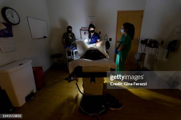 Family physician performs a surgical abortion on a 39-year-old woman who already has four children the day before the Supreme Court overturned Roe v....