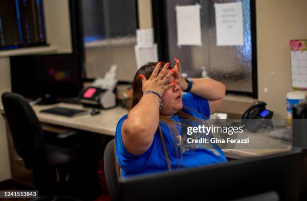 Staff member reacts after just hearing the news that the Supreme Court overturned Roe v. Wade shutting down abortion services at Alamo Womens...