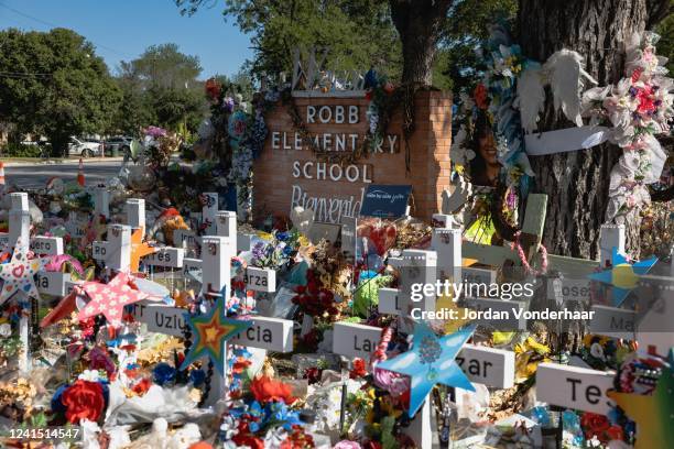 The memorial for the massacre at Robb Elementary School on June 24, 2022 in Uvalde, Texas. Nearly 300 Uvalde High School seniors received their...