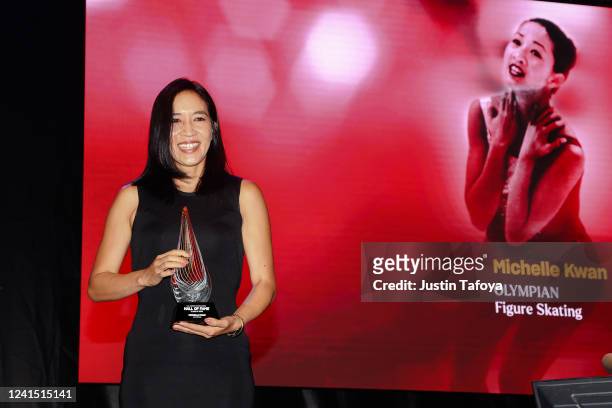 Michelle Kwan accepts her award during the 2022 U.S. Olympic & Paralympic Committee Hall Of Fame Ceremony on June 24, 2022 in Colorado Springs,...