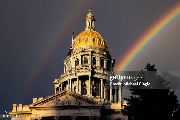 Rainbow forms above the Colorado State Capitol as people gather in protest of the Supreme Court's decision to overturn Roe v. Wade on June 24, 2022...