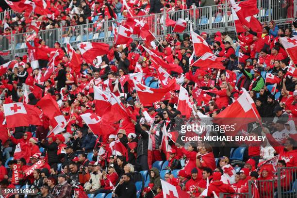 Tongan fans wave the flags during the womens rugby league test match between New Zealand and Tonga at Mt Smart Stadium in Auckland on June 25, 2022.