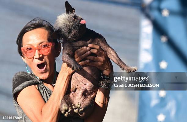 Jeneda Benally reacts to the announcement that her dog Mr. Happy Face won the World's Ugliest Dog Contest in Petaluma, California on June 24, 2022. -...
