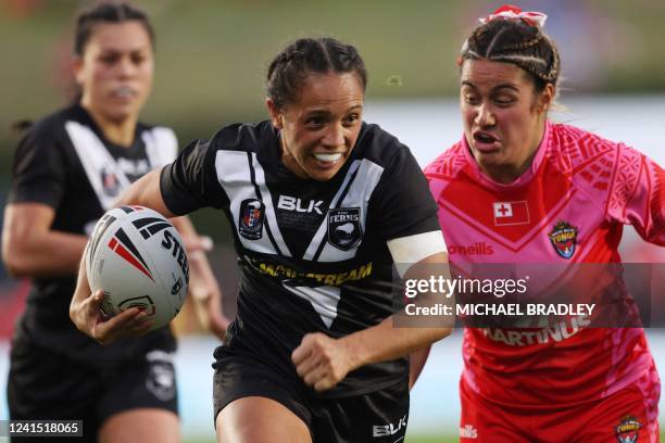 Amy Turner of New Zealand makes a break during the womens rugby league test match between New Zealand and Tonga at Mt Smart Stadium in Auckland on...